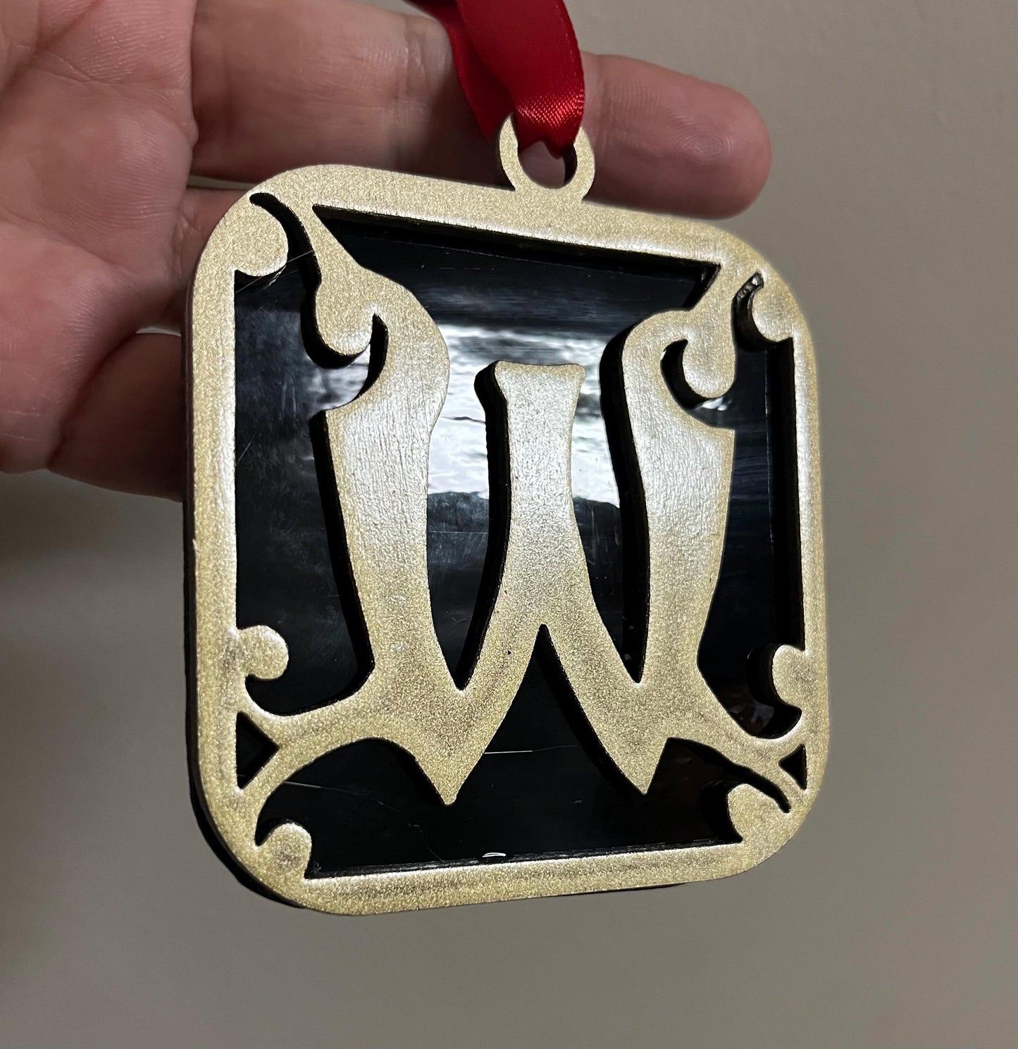 Wells College Ornament: Black & Gold Stained Glass 'W' Logo