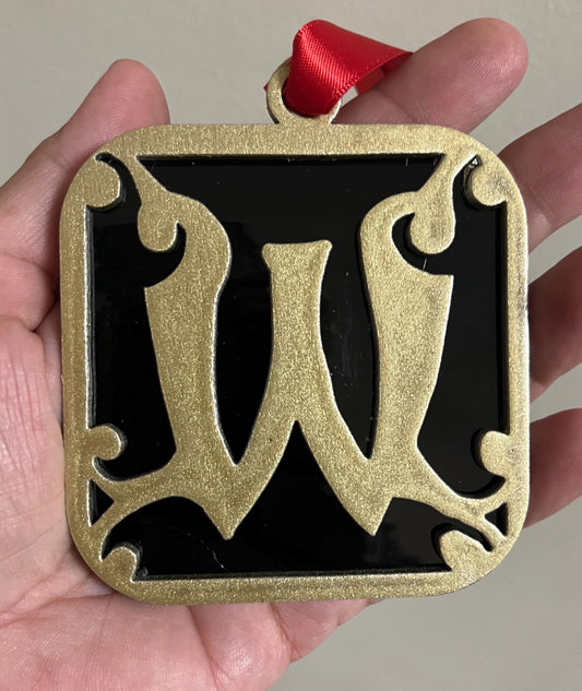 Wells College Ornament: Black & Gold Stained Glass 'W' Logo