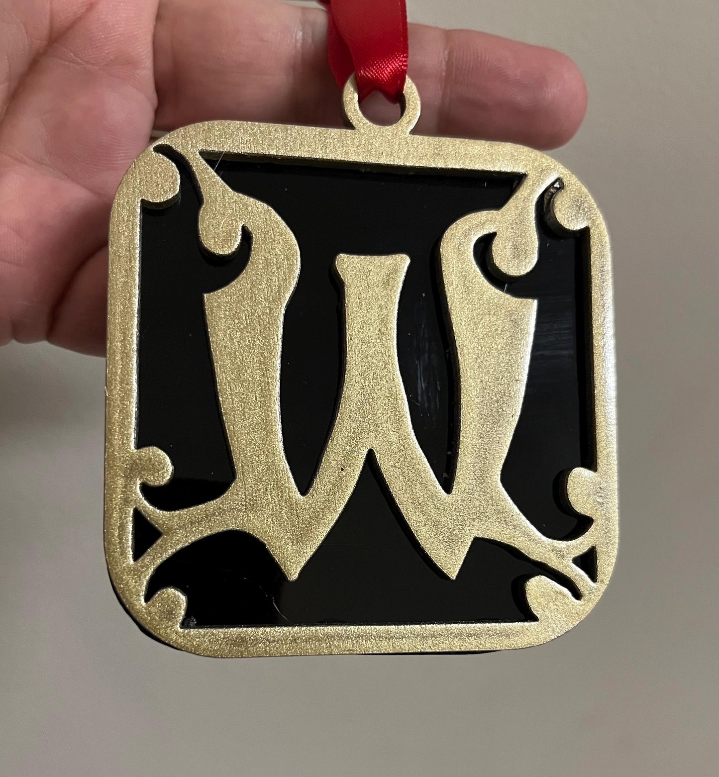 Wells College Ornament: Black & Gold Stained Glass 'W' Logo
